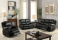 Zuriel - 81" Motion Sofa - Black Synthetic Leather