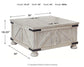 Carynhurst Cocktail Table with Storage