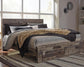 Derekson King Panel Bed with 2 Storage Drawers with Mirrored Dresser, Chest and Nightstand