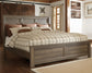 Juararo King Panel Bed with Mirrored Dresser, Chest and Nightstand