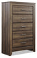 Juararo King Panel Bed with Mirrored Dresser, Chest and Nightstand