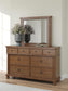 Chadworth Queen Poster Bed with Mirrored Dresser and Nightstand